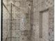 Shower featuring stylish tile design and a convenient built-in niche for storage at 2714 Vindale Rd, Tavares, FL 32778