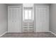 Bedroom closet featuring two closets with drawers and a small window at 2714 Vindale Rd, Tavares, FL 32778