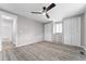 Cozy bedroom with neutral tones, plush carpet, and ample closet space, creating a relaxing retreat at 2714 Vindale Rd, Tavares, FL 32778