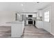 Well-equipped kitchen featuring an island, stainless steel appliances, and ample cabinet space, ideal for cooking enthusiasts at 2714 Vindale Rd, Tavares, FL 32778