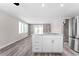 Open concept kitchen with large kitchen island and stainless steel appliances at 2714 Vindale Rd, Tavares, FL 32778