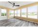 Sun room features hardwood floors, lots of windows and access to the outdoors at 2714 Vindale Rd, Tavares, FL 32778