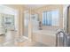 Bathroom features a soaking tub and glass shower at 27536 Stoney Brook Dr, Leesburg, FL 34748