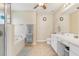 Bathroom features a soaking tub and single sink vanity at 27536 Stoney Brook Dr, Leesburg, FL 34748