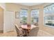 Bright breakfast nook with a table and chairs, large windows, and tile flooring at 27536 Stoney Brook Dr, Leesburg, FL 34748