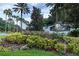Welcoming Legacy at Leesburg community entrance with lush landscaping and an elegant sign at 27536 Stoney Brook Dr, Leesburg, FL 34748