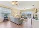 Spacious living room with tile flooring, ceiling fans and lots of natural light at 27536 Stoney Brook Dr, Leesburg, FL 34748