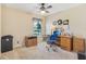 Functional office space with desk, chair, and ample storage, perfect for work or hobbies at 27536 Stoney Brook Dr, Leesburg, FL 34748