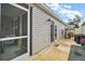 Home exterior showcases a cozy screened porch and fenced pet area at 2866 Judah St, The Villages, FL 32163