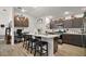 Spacious kitchen with an island, breakfast bar, stainless steel appliances, and laminate floors at 2866 Judah St, The Villages, FL 32163