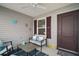 Cozy covered front porch features seating, decor, and a welcoming entrance at 2866 Judah St, The Villages, FL 32163