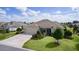 Charming single-story home featuring a well-maintained lawn and an attached two-car garage at 2935 Cedar Grove Loop, The Villages, FL 32163