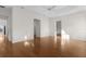 Large bedroom with hardwood floors, a ceiling fan, and an ensuite bathroom at 2935 Cedar Grove Loop, The Villages, FL 32163