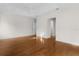 Expansive bedroom with wood floors, ensuite bath, and ceiling fan at 2935 Cedar Grove Loop, The Villages, FL 32163