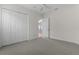 Spacious bedroom featuring plush carpeting and ample closet space at 2935 Cedar Grove Loop, The Villages, FL 32163