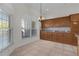 Cozy dining area with tile flooring, large windows, and built-in cabinets at 2935 Cedar Grove Loop, The Villages, FL 32163