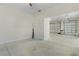 A view from the flex space into the spacious 3 car garage with high ceilings and plenty of room for parking at 2935 Cedar Grove Loop, The Villages, FL 32163