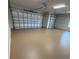 Clean, spacious garage with new epoxy flooring and two separate doors for easy access at 2935 Cedar Grove Loop, The Villages, FL 32163