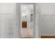 Hallway leading to bathroom featuring closet space at 2935 Cedar Grove Loop, The Villages, FL 32163