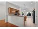 Open kitchen with stone countertops, stainless steel appliances, and ample cabinet space at 2935 Cedar Grove Loop, The Villages, FL 32163