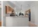 Bright kitchen with breakfast bar, stainless steel appliances, and ample counter space at 2935 Cedar Grove Loop, The Villages, FL 32163