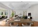 Bright and airy living room showcasing a dining area and access to a patio at 2935 Cedar Grove Loop, The Villages, FL 32163