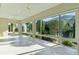 Bright sunroom with tile flooring and panoramic views of the outdoors at 2935 Cedar Grove Loop, The Villages, FL 32163