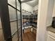 Organized walk-in pantry with wire shelving, baskets, and a variety of storage containers for food and supplies at 295 Whirlaway Drive, Davenport, FL 33837