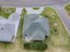 Aerial shot of property, highlighting the roof, patio, and surrounding neighborhood at 3067 Southern Trce, The Villages, FL 32162