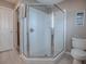 Bright bathroom featuring a tiled shower with a glass enclosure and neutral decor at 3067 Southern Trce, The Villages, FL 32162