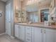 Bright bathroom with plenty of vanity countertop space and natural light at 3067 Southern Trce, The Villages, FL 32162