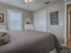 Inviting bedroom showcasing a neutral color palette, closet, and stylish decor accents at 3067 Southern Trce, The Villages, FL 32162