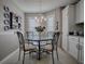 Charming dining nook with round table, chandelier, and lots of natural light at 3067 Southern Trce, The Villages, FL 32162