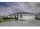 Charming single-story home with a two-car garage and well-maintained landscaping at 3067 Southern Trce, The Villages, FL 32162