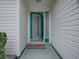 Inviting entryway featuring a decorative glass door and sidelight panels at 3067 Southern Trce, The Villages, FL 32162