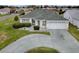 Well maintained single-story home featuring a circular driveway and manicured landscaping at 3067 Southern Trce, The Villages, FL 32162