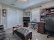 Comfortable home office features large desk, leather furniture, and TV entertainment at 3067 Southern Trce, The Villages, FL 32162