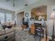 Comfortable living room and desk area with an open floor plan at 3067 Southern Trce, The Villages, FL 32162