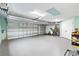 Spacious two car garage with an automatic door at 3233 Belcherry Loop, The Villages, FL 32163