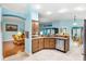 Modern kitchen featuring stainless steel appliances, granite countertops and view to living room at 3233 Belcherry Loop, The Villages, FL 32163
