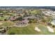 Overhead view of the golf course with a large pond at 3234 Berkeley Ln, The Villages, FL 32162
