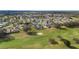 An aerial shot of a neighborhood situated on a golf course at 3234 Berkeley Ln, The Villages, FL 32162