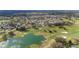 Bird's eye view of homes bordering a golf course and a beautiful pond at 3234 Berkeley Ln, The Villages, FL 32162