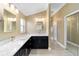 Bathroom featuring dual sinks, ample counter space, and modern fixtures at 3234 Berkeley Ln, The Villages, FL 32162
