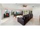 Spacious game room featuring a billiard table, tile flooring, large windows, recessed lights, and a ceiling fan at 3234 Berkeley Ln, The Villages, FL 32162
