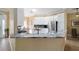 Bright kitchen boasts sleek countertops, stainless steel appliances, and ample cabinet space at 3234 Berkeley Ln, The Villages, FL 32162