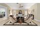 Bright living room with a decorative area rug, comfortable seating, and natural light at 3234 Berkeley Ln, The Villages, FL 32162