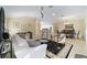 Expansive living room with an open floor plan and access to the kitchen and dining areas at 3234 Berkeley Ln, The Villages, FL 32162