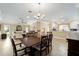 Open-concept living space with views of the dining area and kitchen at 3234 Berkeley Ln, The Villages, FL 32162