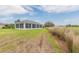 Enjoy this beautiful home's screened sunroom that overlooks a lovely lawn at 3234 Berkeley Ln, The Villages, FL 32162